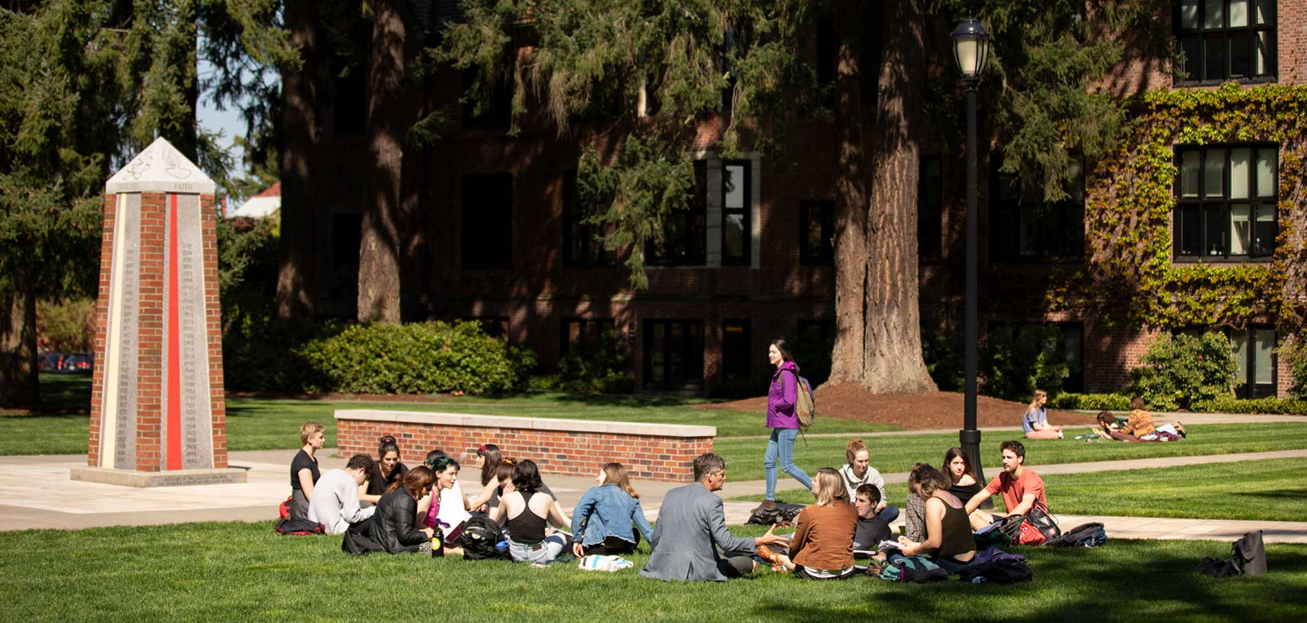 students sitting outside