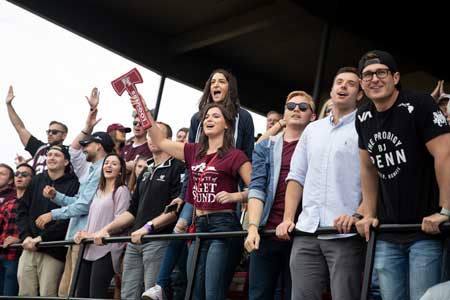 students cheering on a game